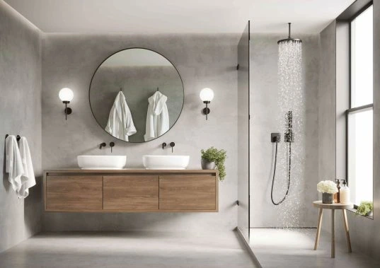 Hotel-Badezimmer: 8 Tipps für ein modernes Design und Wohlfühlambiente 8
3d modern contemporary grey concrete bathroom with round mirror and shower