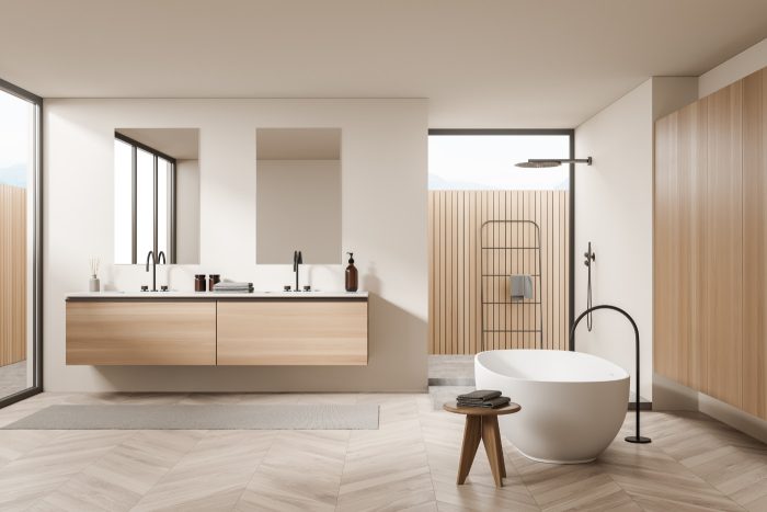 Helle Badezimmereinrichtung mit Wanne und zwei Waschbecken mit Spiegeln, Dusche und Geländerleiter im Hintergrund, Parkettboden und Tisch. 3D-Rendering